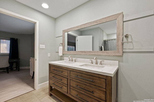 bathroom with vanity and hardwood / wood-style floors