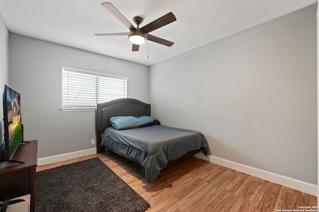 bedroom featuring light hardwood / wood-style floors and ceiling fan