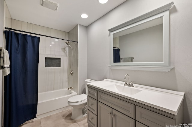 full bathroom with toilet, shower / bath combo, vanity, and tile patterned flooring