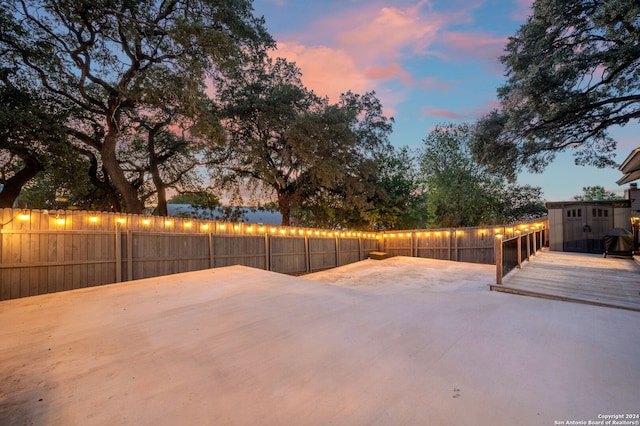 view of patio terrace at dusk