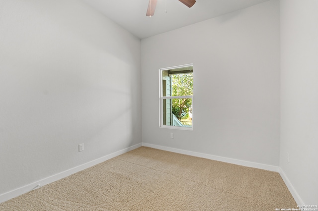 carpeted empty room with ceiling fan