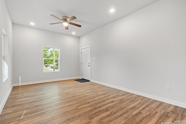 empty room featuring light hardwood / wood-style floors and ceiling fan