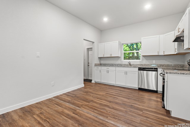 kitchen featuring stainless steel dishwasher, white cabinetry, light stone counters, and dark hardwood / wood-style floors