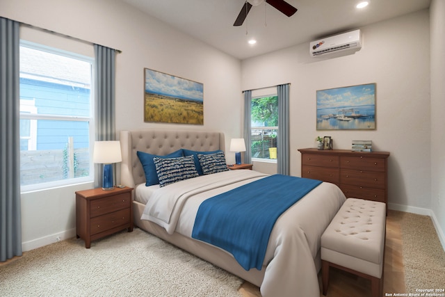 carpeted bedroom featuring ceiling fan, multiple windows, and a wall mounted air conditioner