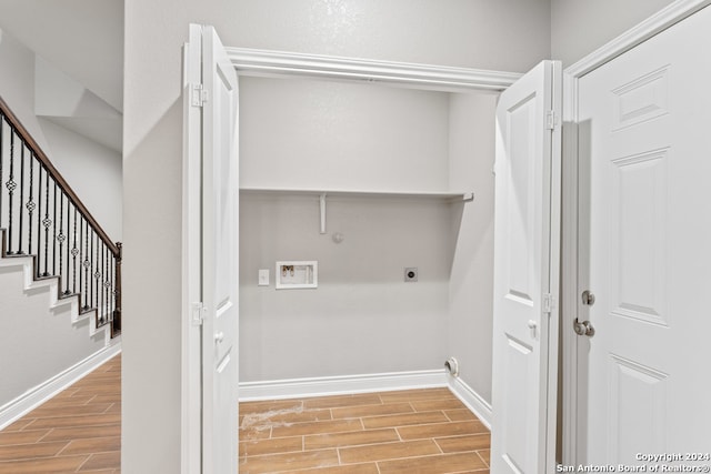 laundry area featuring light hardwood / wood-style flooring, washer hookup, and electric dryer hookup