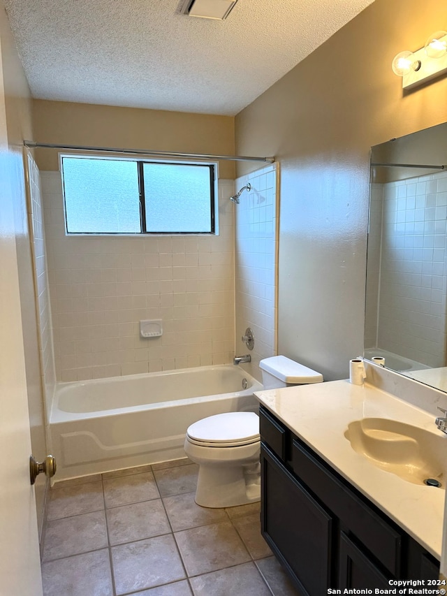 full bathroom with tiled shower / bath, vanity, a healthy amount of sunlight, and toilet