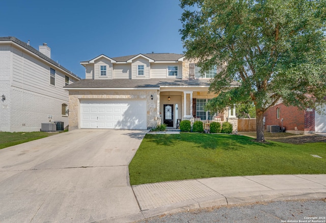 view of front of property with central AC, covered porch, a garage, and a front lawn