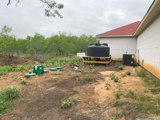 view of yard with central AC unit