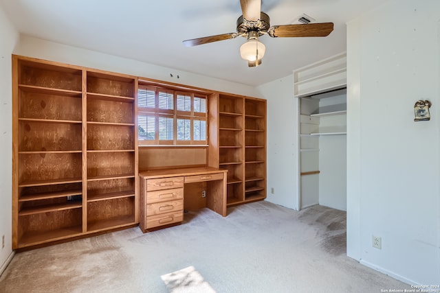 unfurnished office with light colored carpet and ceiling fan