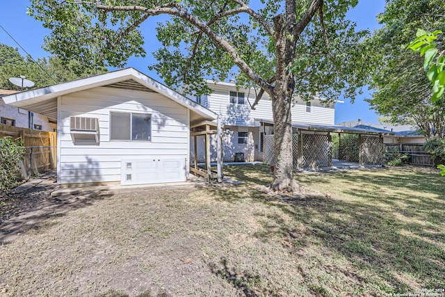 rear view of house featuring a yard