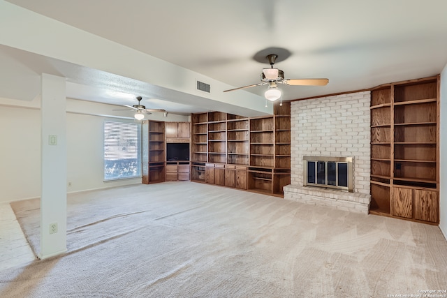 unfurnished living room featuring light carpet, a fireplace, and ceiling fan