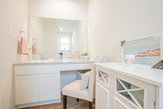 bathroom featuring vanity and hardwood / wood-style flooring