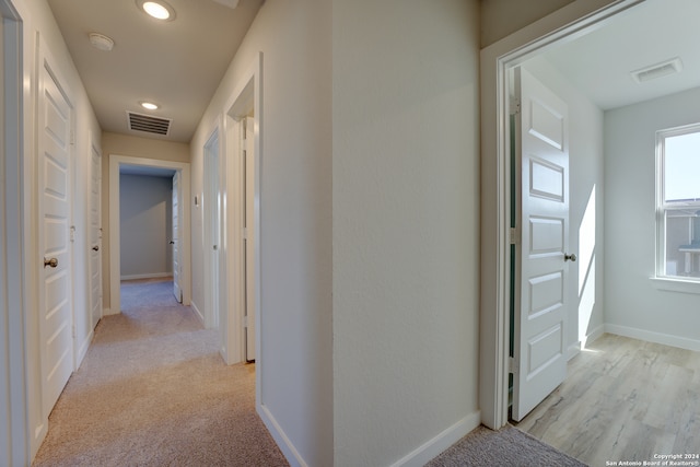 corridor with light carpet