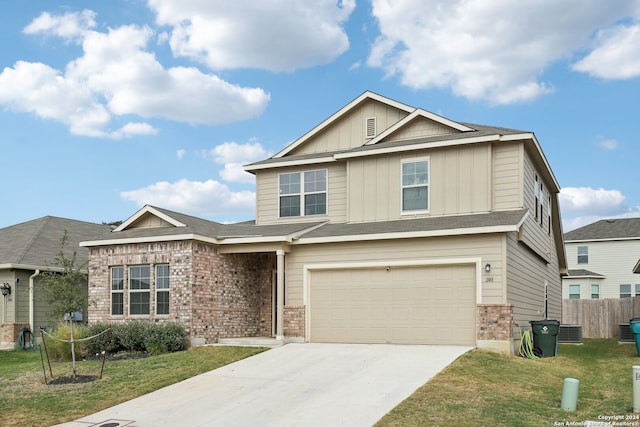 view of front of home featuring a front lawn and a garage