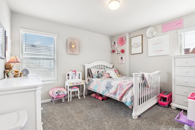 bedroom with multiple windows and carpet floors