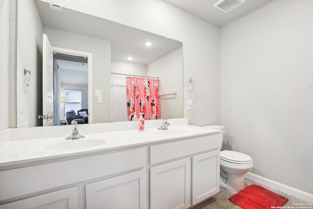 bathroom featuring toilet, walk in shower, vanity, and tile patterned flooring