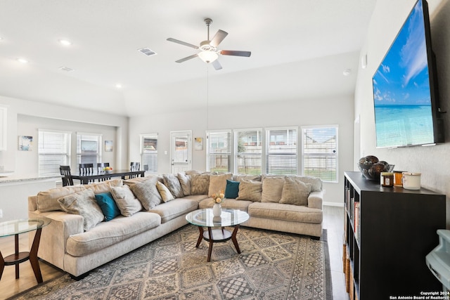 living room with ceiling fan, plenty of natural light, and hardwood / wood-style floors