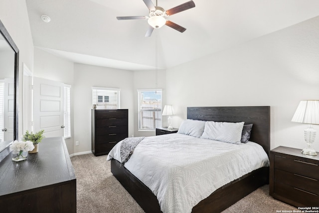 carpeted bedroom featuring lofted ceiling and ceiling fan