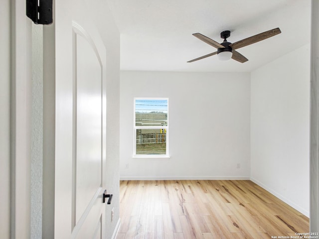 empty room featuring light hardwood / wood-style flooring and ceiling fan