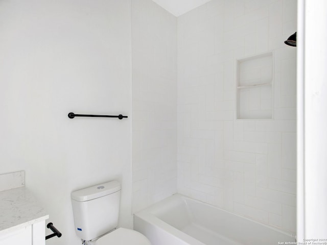 full bathroom featuring vanity, toilet, and tiled shower / bath