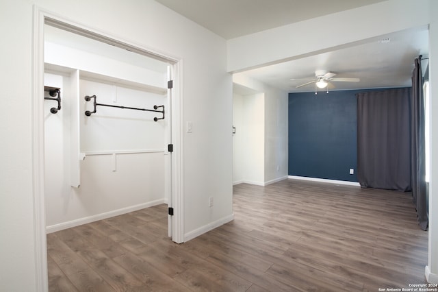 spare room with ceiling fan and dark hardwood / wood-style flooring