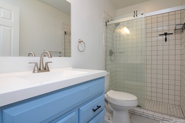 bathroom with vanity, toilet, and walk in shower