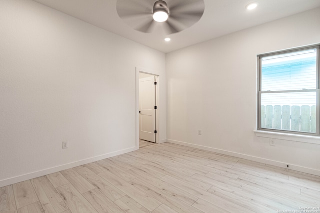 empty room featuring ceiling fan and light wood-type flooring