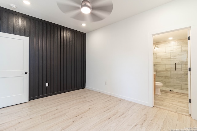 unfurnished room featuring ceiling fan and light hardwood / wood-style flooring