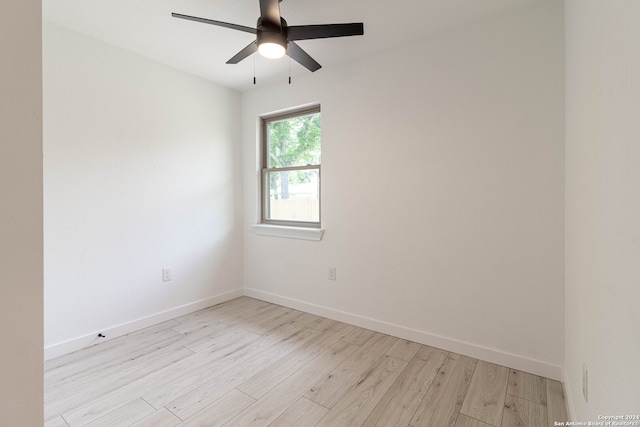 spare room with light hardwood / wood-style floors and ceiling fan