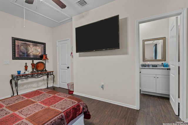 bedroom featuring ensuite bathroom, dark wood-type flooring, and ceiling fan