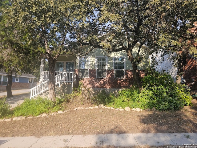 view of property hidden behind natural elements