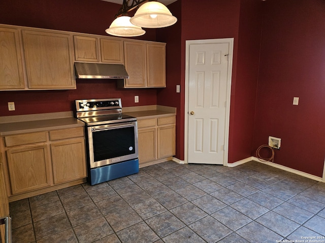 kitchen featuring light brown cabinets, electric range, pendant lighting, and dark tile patterned flooring