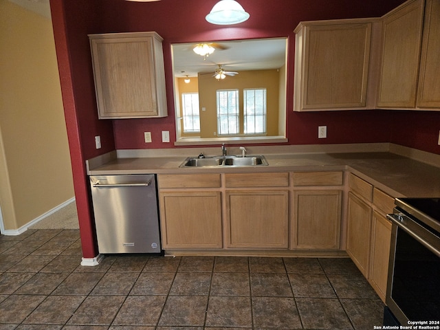 kitchen featuring dark tile patterned floors, light brown cabinets, sink, appliances with stainless steel finishes, and ceiling fan