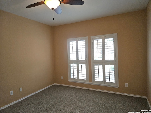 carpeted empty room with ceiling fan