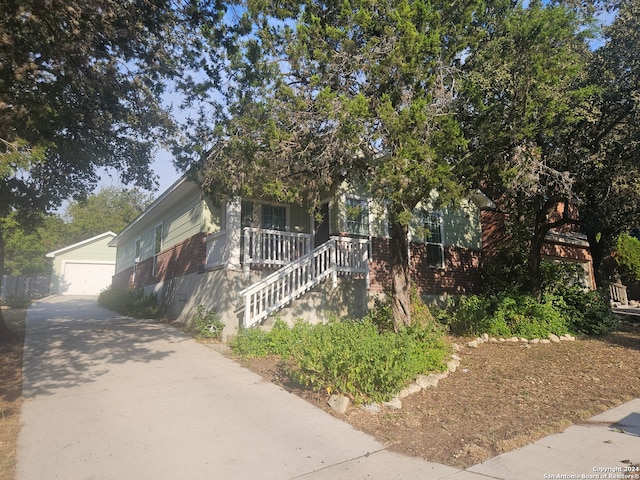 obstructed view of property with a porch