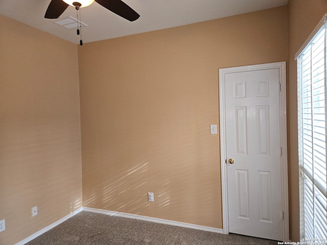 unfurnished room with carpet floors and ceiling fan