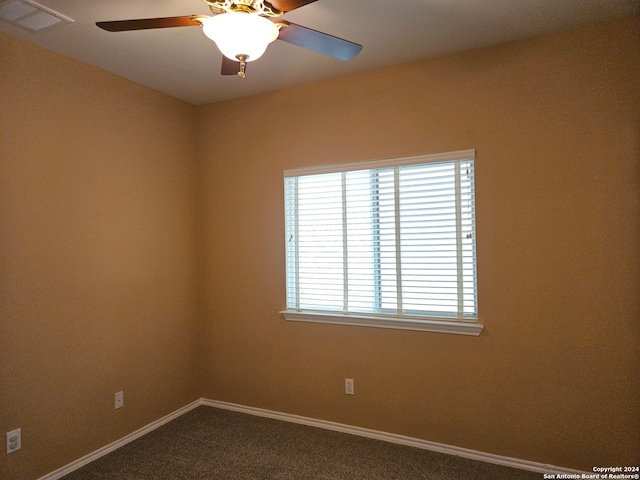 carpeted empty room with ceiling fan