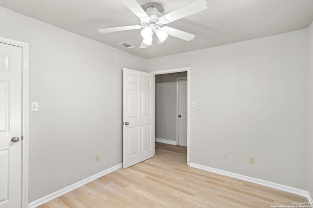 unfurnished bedroom featuring light hardwood / wood-style flooring and ceiling fan