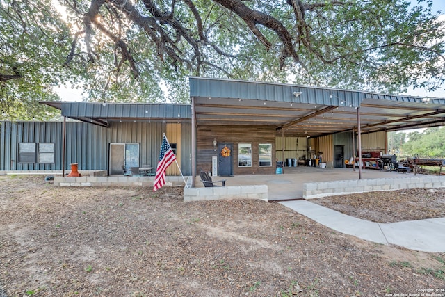 exterior space with a carport