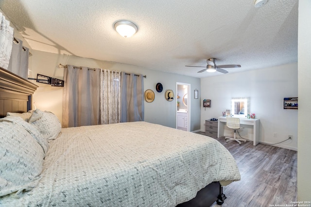 150 S Fisher Ln, Poteet, TX 78065 - bedroom with a textured ceiling, baseboards, a ceiling fan, wood finished floors, and ensuite bath