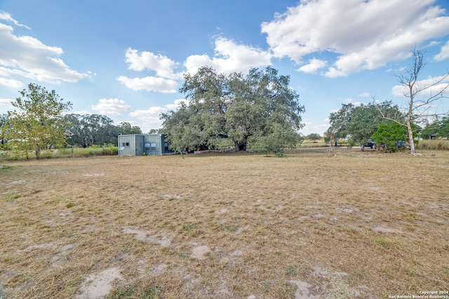 view of yard with a rural view