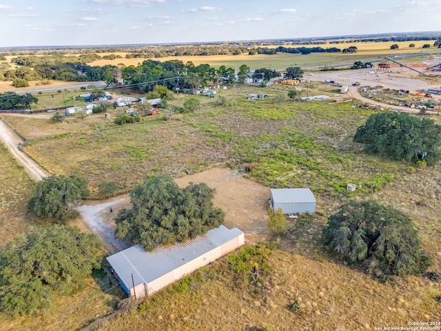 birds eye view of property with a rural view