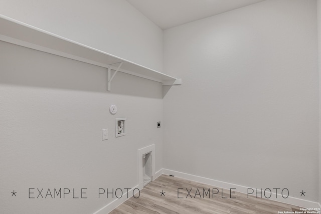 laundry room featuring hookup for a washing machine, hookup for a gas dryer, and light hardwood / wood-style flooring