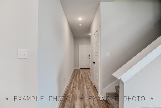 corridor with light hardwood / wood-style flooring