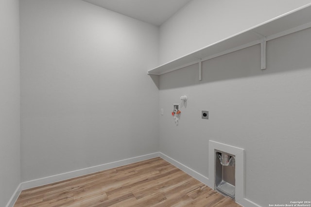2533 Solon Ln, Seguin, TX 78115 - laundry area featuring gas dryer hookup, electric dryer hookup, light wood-type flooring, and washer hookup