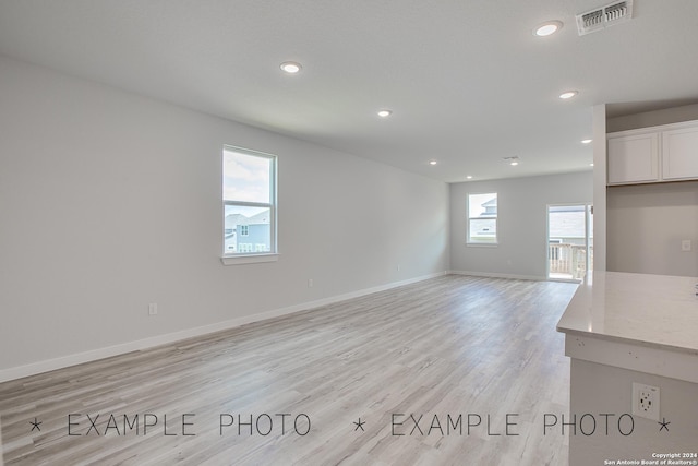 unfurnished living room with light hardwood / wood-style floors