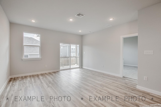 unfurnished room featuring light wood-type flooring