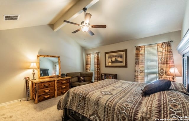 carpeted bedroom featuring ceiling fan, multiple windows, and vaulted ceiling with beams