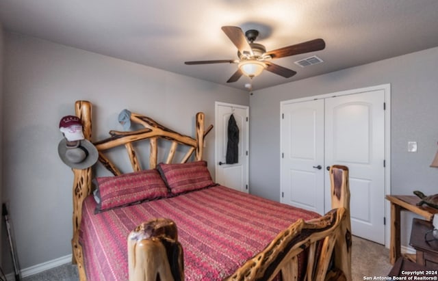 carpeted bedroom featuring a closet and ceiling fan