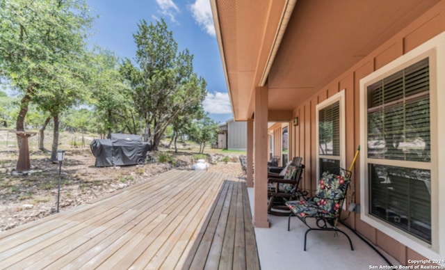 wooden deck featuring area for grilling